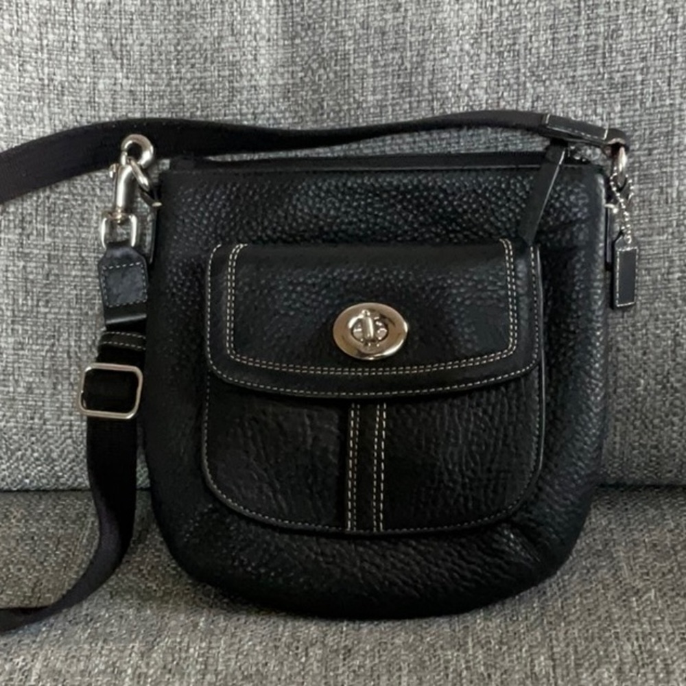 Black pebble LEATHER COACH crossbody bag with web strap.